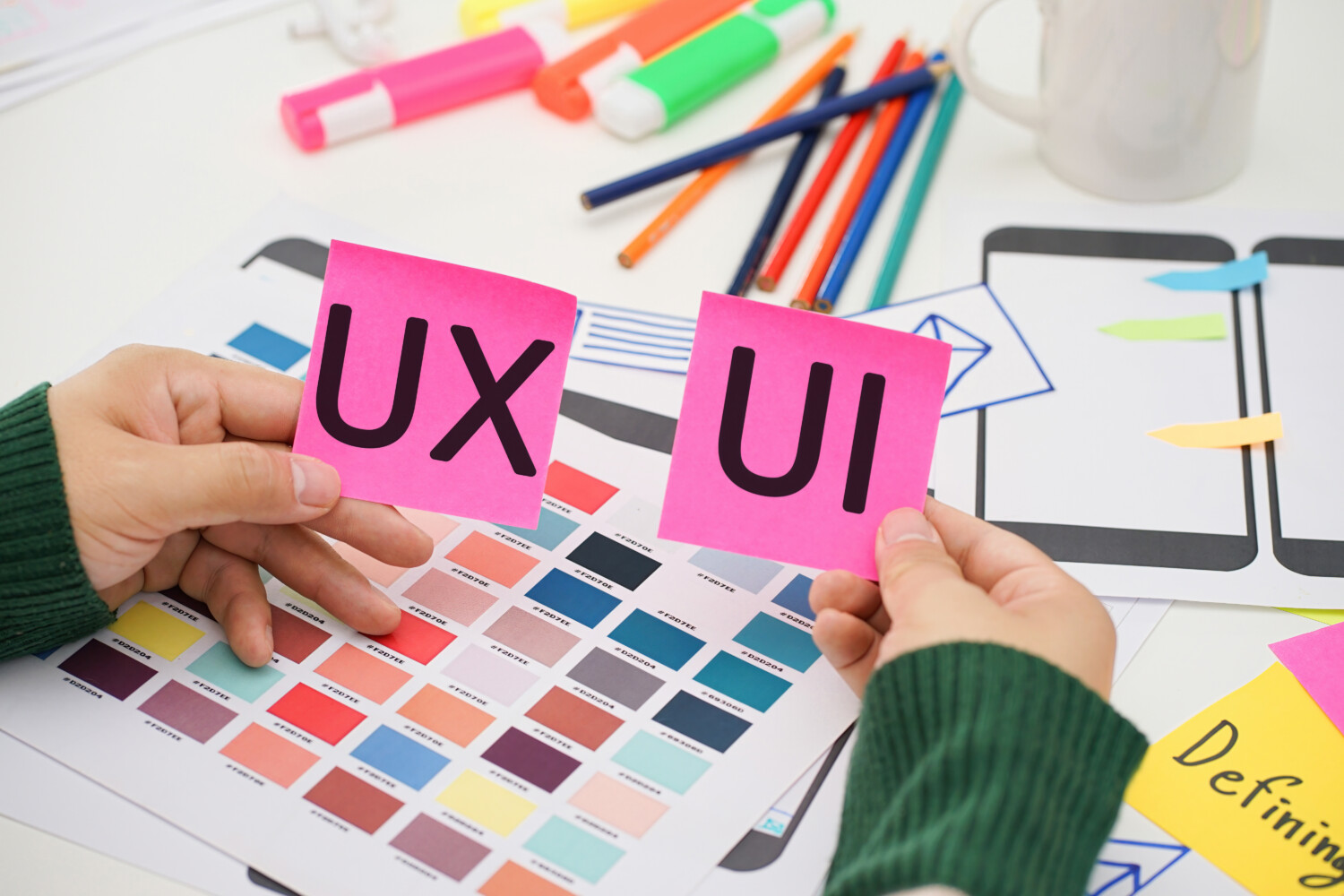 Creative top view photo of UX UI designer working space. User experience concept